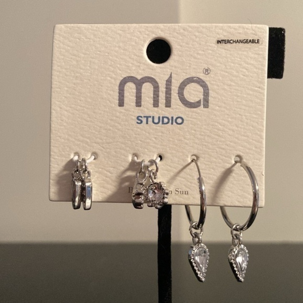 MIA silver tone hoop earrings with mix and match charms.